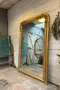 Ancien miroir doré en stuc XIXème de style Louis XVI