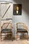 Paire de fauteuils en faux bambou de style régence 1970